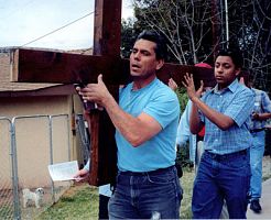 Ministers and members participate in a Good Friday Ecumenical Way of the Cross in St. George