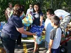Ladies of Charity distribute backpacks and food for families in need