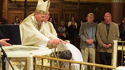 Newly baptized are received into the Catholic Church at the Easter Vigil
