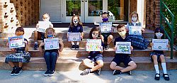 Our Lady of Lourdes students explore their faith by wearing masks
