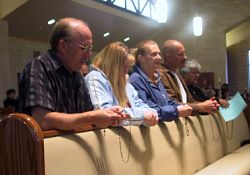 Prayers are offered for world peace and vocations