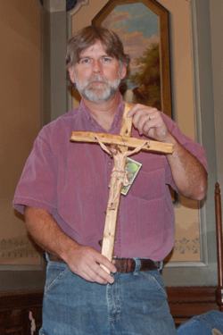 The cross and crucifix motivate Catholic convert to carve his faith