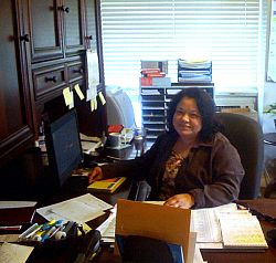 A parishioner keeps up with her services at her parish