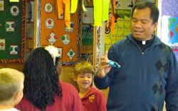 Fr. Rene explains new Roman Missal changes to students