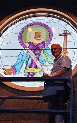 Stained-glass window of patron saint installed at St. Olaf Catholic School in Bountiful